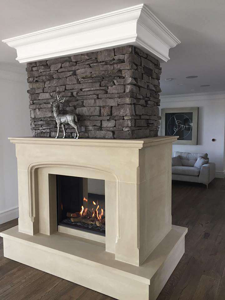 Double sided bespoke sandstone fireplace